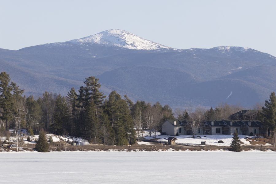 The ice out watch on area lakes has begun with recent warm weather. Mirror Lake in Lake Placid was completely covered with ice on March 22, but should see some melting in the near future. Photo by Mike Lynch