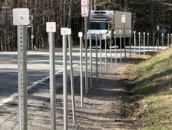 Posts block roadside parking on State Route 73.