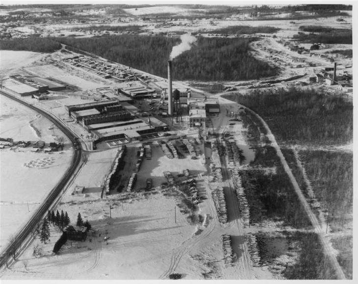 Tupper Lake's Oval Wood Dish factory in its heyday, with smoke drifting from the smokestack.