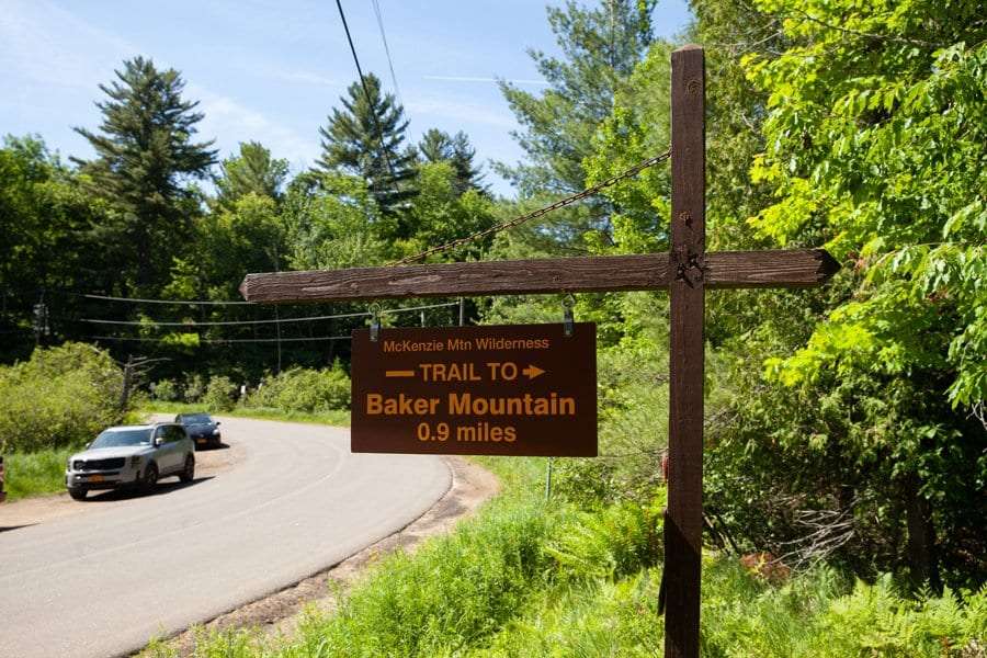 Cars park on the road's shoulder at Baker Mountain Trailhead.