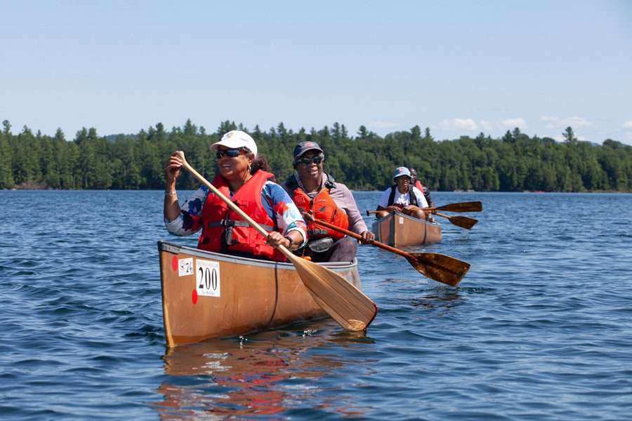 Canoeists paddle with Outdoor Afro in the adirondacks