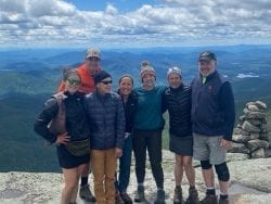 Publisher Tracy Ormsbee with friends hiking Mount Marcy.