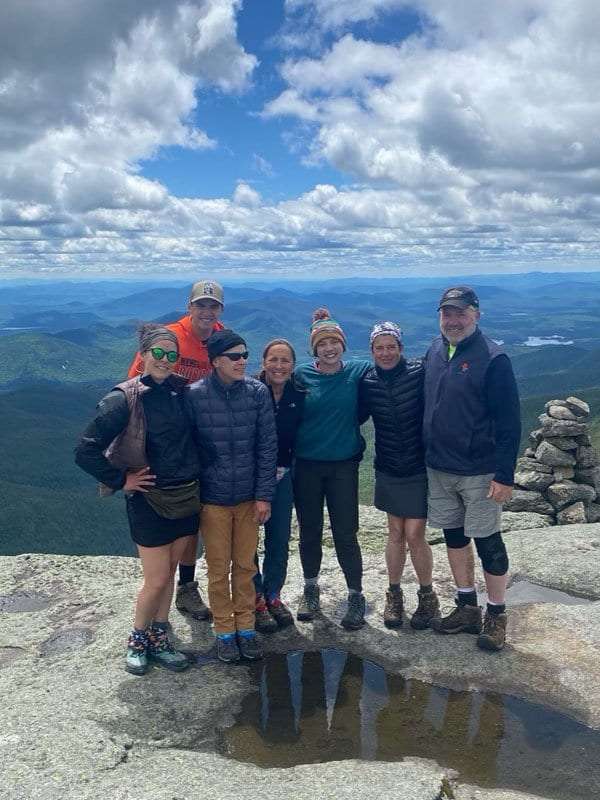 Publisher Tracy Ormsbee with friends hiking Mount Marcy.
