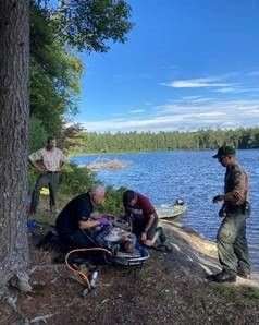 AFRs Bowler and Farry and EMS personnel on shore of Little Square Pond