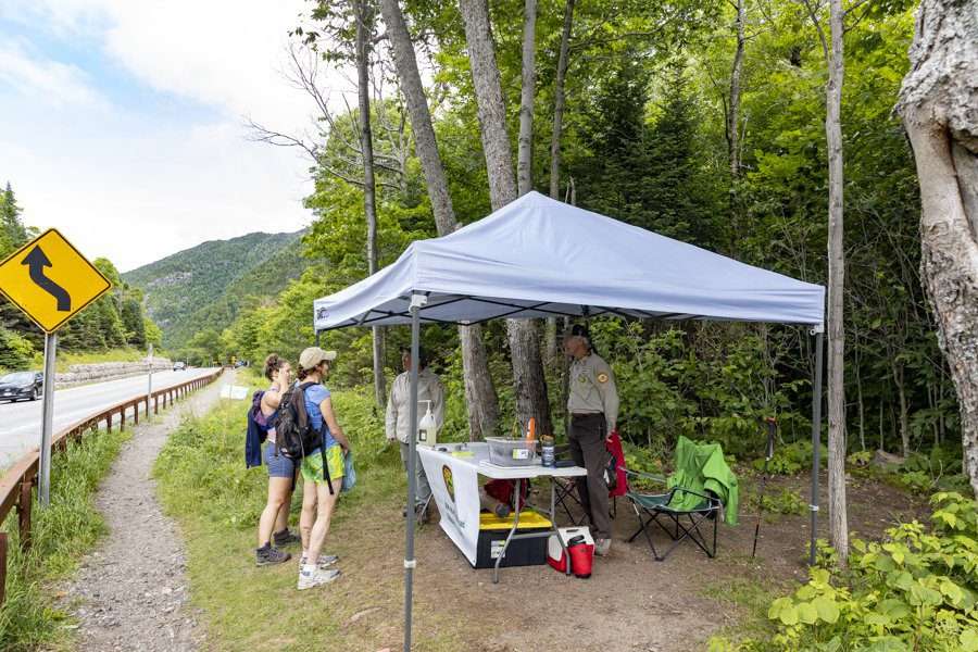 he Adirondack 46ers have set up trailhead information stations at Cascade Mountain and the end of South Meadow Road, as shown here at Cascade in 2021. Photo by Mike Lynch