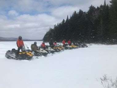 Snowmobiles fall through ice on Long Lake