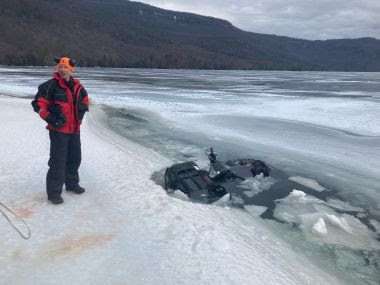 ATV gets stuck in the ice in Lake George