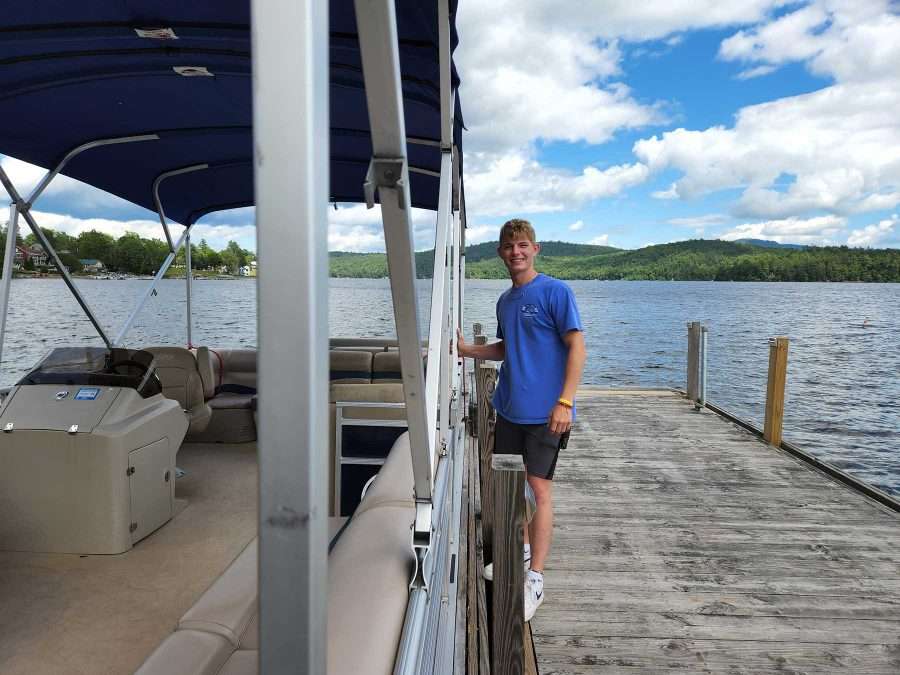 Ethan Rehn operates the boat that transports visitors to and from The Island. Photo by James M. Odato.