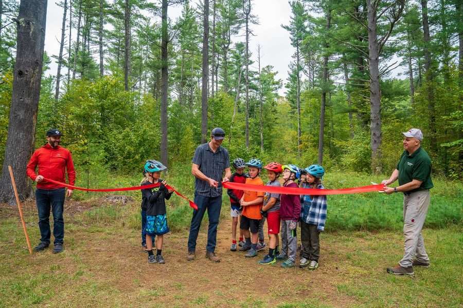 Luke Peduzzi is cutting the ribbon on new Keene bike trails