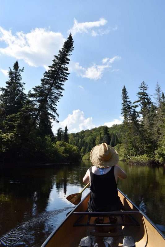 Fortunately, multiple riffles and rapids are punctuated with splendid flatwater sections, though rocks often bit the bottom of our boat from below.