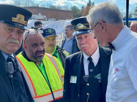 Railroad volunteers plot strategy for the return trip to Utica.