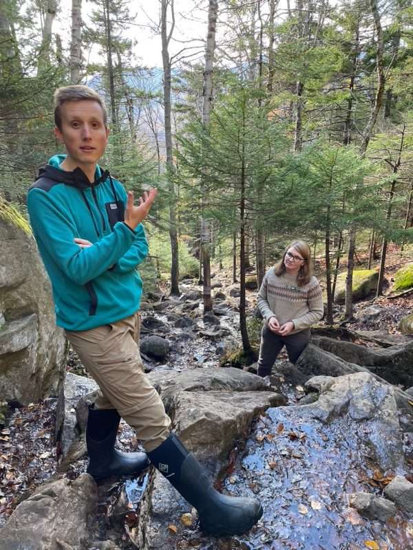 Ben Brosseau, ADK director of communications, and Charlotte Staats at a eroded trail section that will be rerouted in 2023.