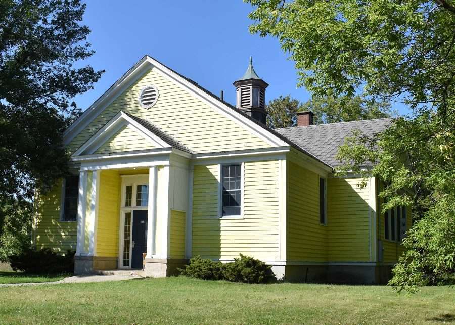 The one-room, Whallonsburg Schoolhouse was built in 1931-32 after the original 1851 schoolhouse burned. Designed by Alvin W. Inman, a prolific Plattsburgh architect who designed many schools in Northern New York, it is now a private residence.