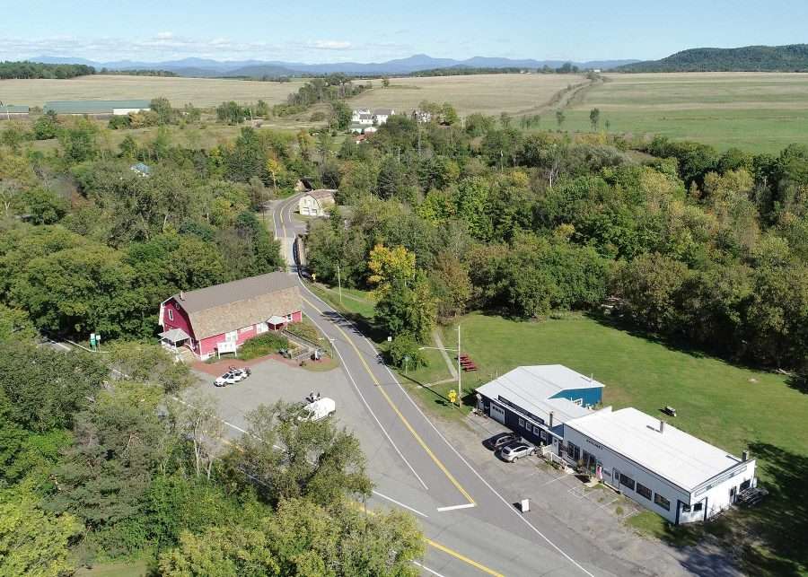 The Hamlet of Whallonsburg with its red Grange Hall in the center of the photo, the historic home of Patrons of Husbandry Chapter #954. Whitcomb’s Garage, recently acquired by the nonprofit Whallonsburg Grange Hall, Inc. for a community center, is across the street.