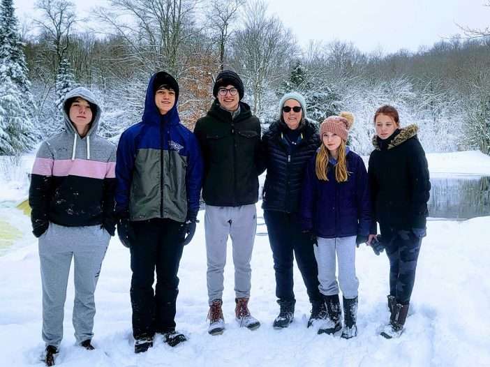 beth pashley with her grandchildren on a hike