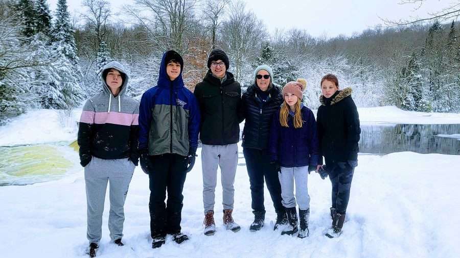 beth pashley with her grandchildren on a hike