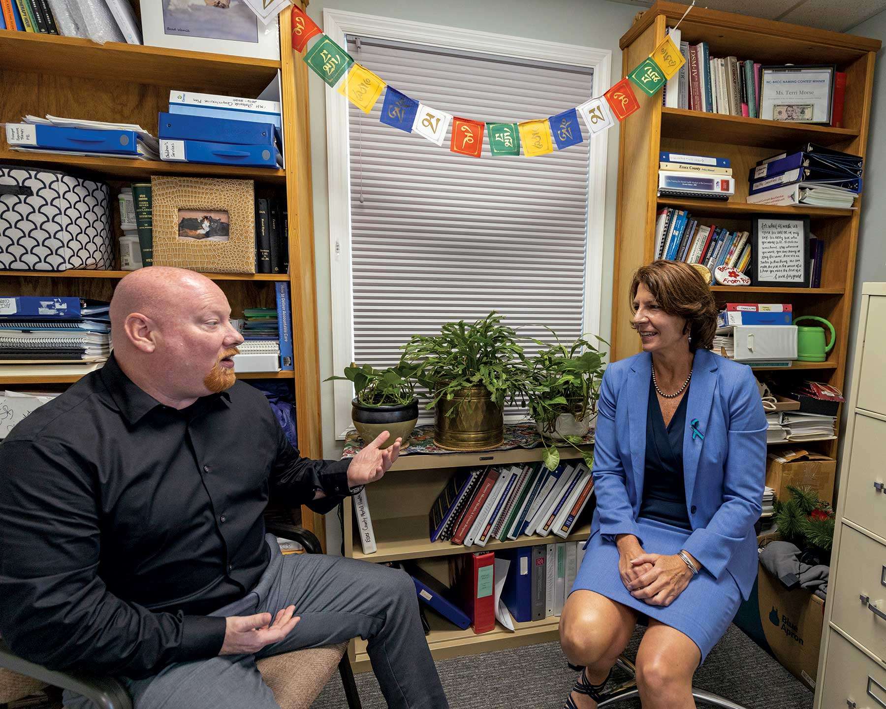 Tom Bull, a personal development trainer and positive culture consultant, and Terri Morse, director of Essex County Mental Health and Community Services, meet in Elizabethtown.