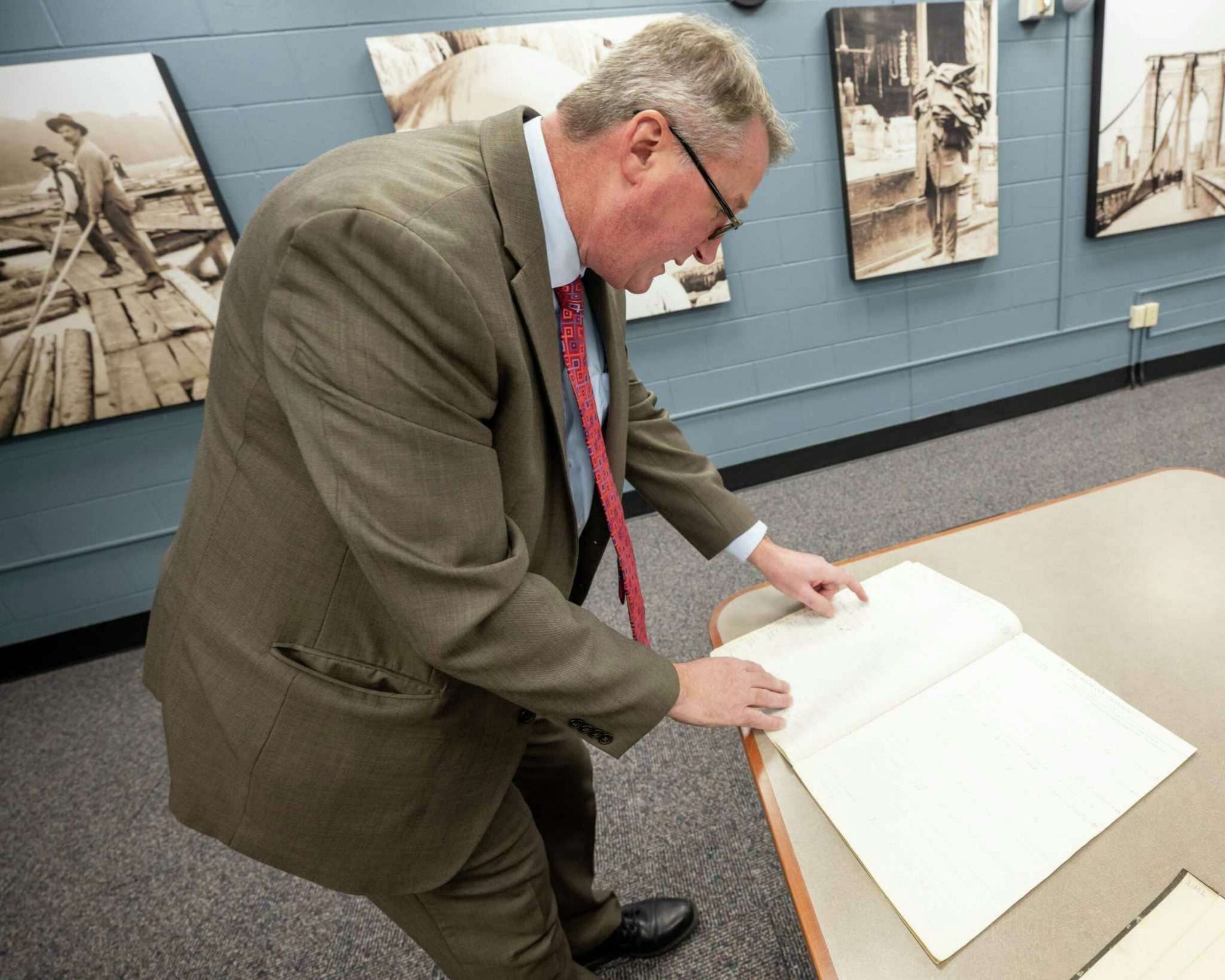 Tom Ruller, the New York state archivist, with some historical documents from the 3,000 properties in the Adirondack Park that were given to former slaves