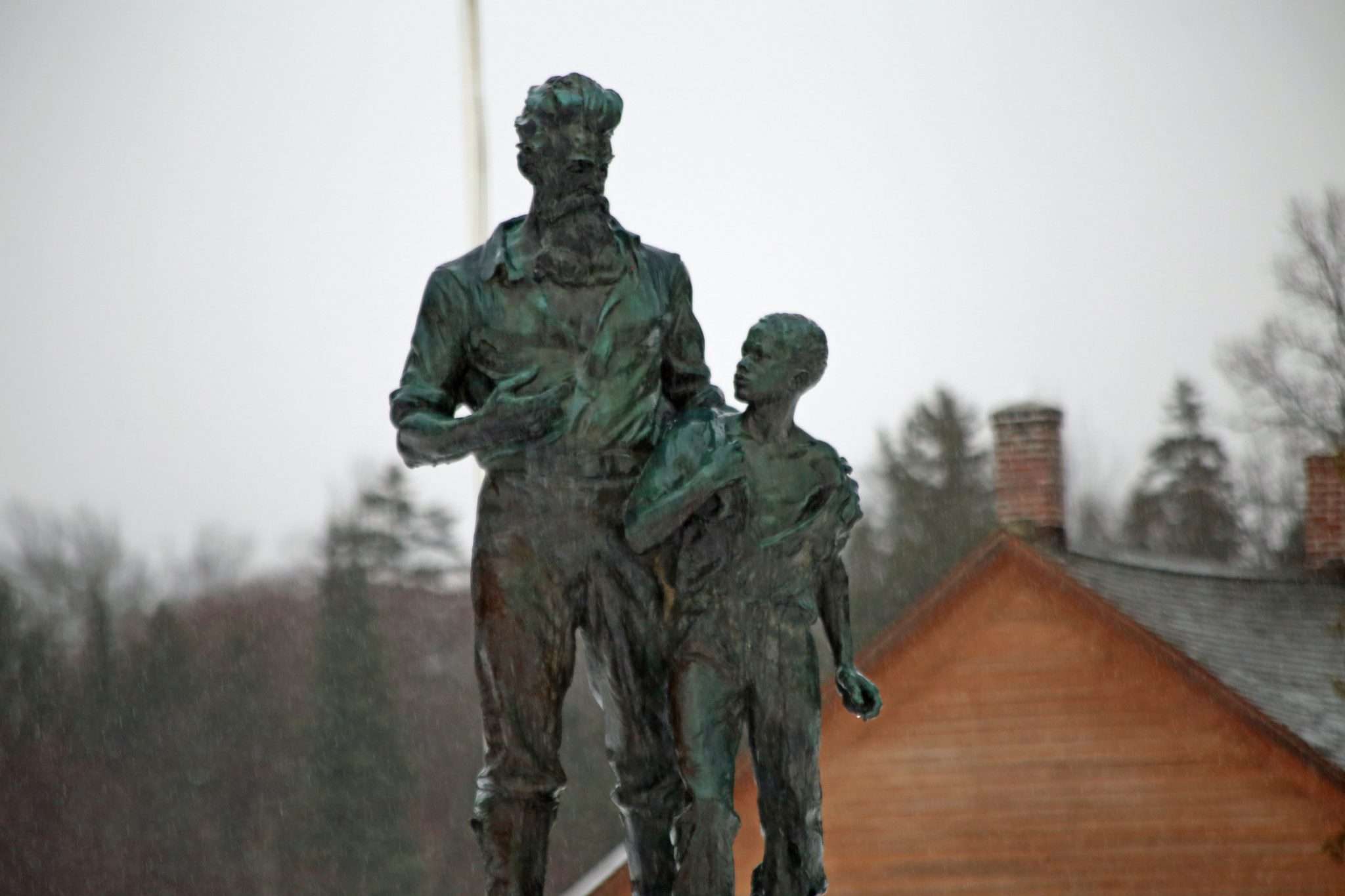 A statue of abolitionist John Brown and an African American child at John Brown Farm in North Elba. 