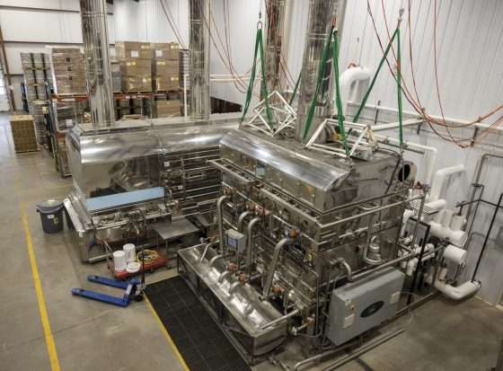 Sap is boiled down to syrup inside the evaporator at the New Leaf Tree Syrups sugar house in Lyon Mountain. Photo by Mike Lynch