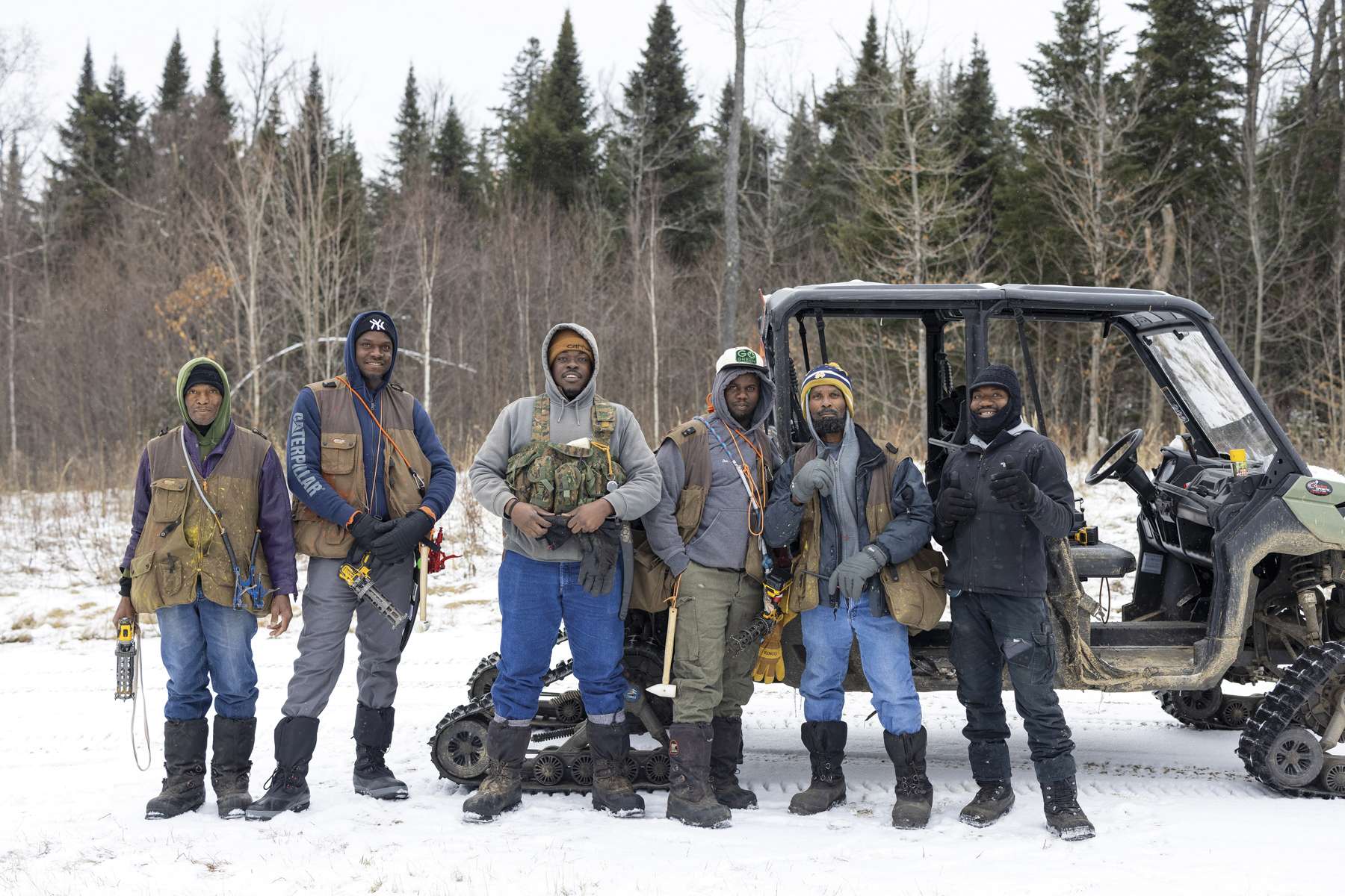 art of the crew, consistenting of workers from Jamaica, poses for a photo before heading into the field for the first day of tapping in early January. Photo by Mike Lynch