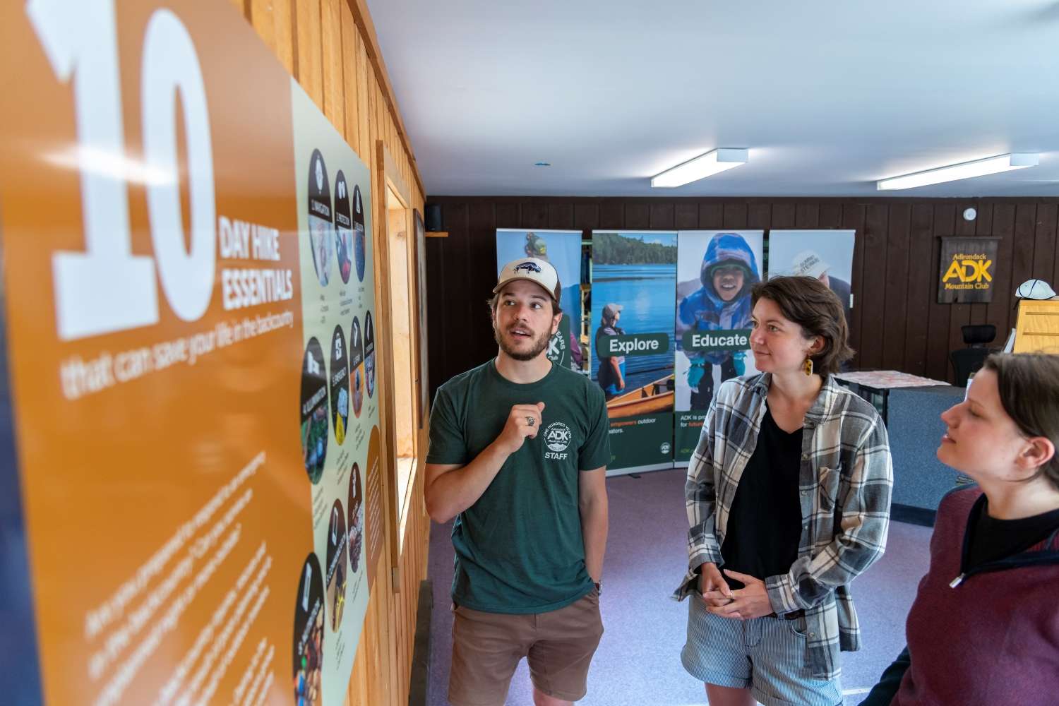 Henry Liebers, visitor information manager for the Adirondack Mountain Club, talks to hikers at the Cascade Welcome Center near Lake Placid. Photo courtesy of ADK