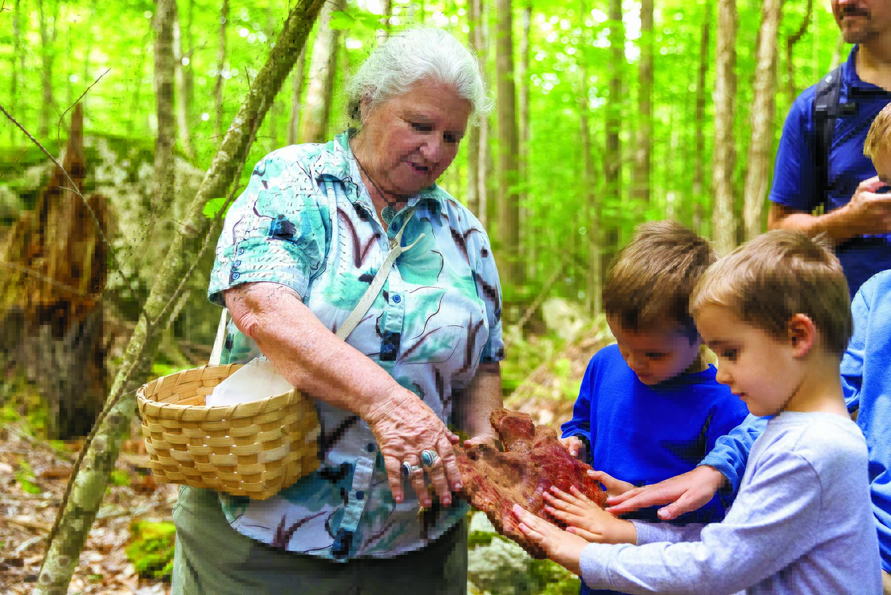Herbalist Jane Desotelle shows a Reishi mushroom to Landon and Grayson Mears during a tour in St. Huberts. Photo by Mike Lynch