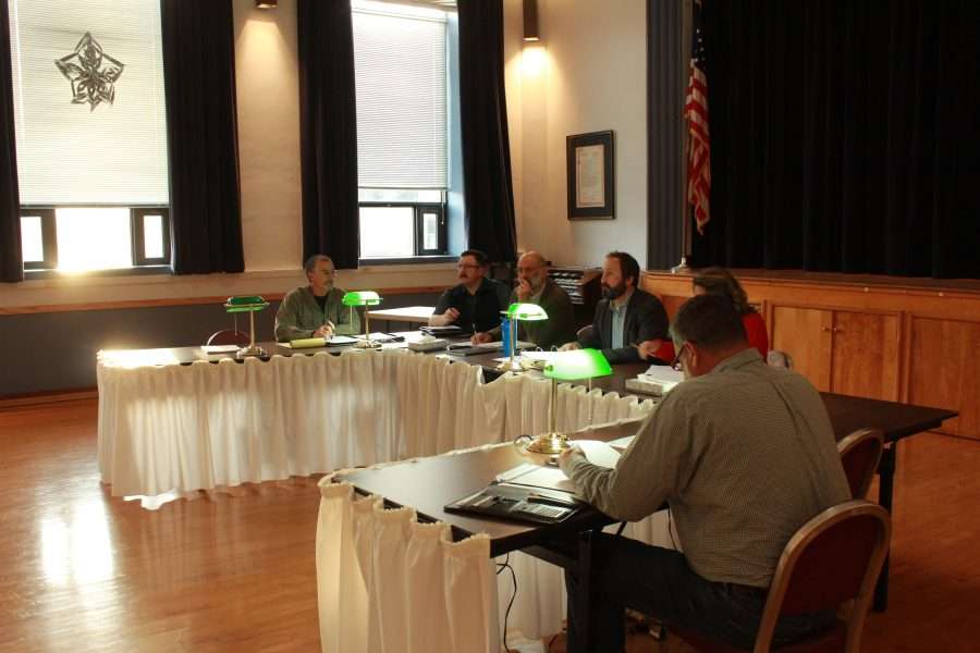 Town board members begin a meeting in Long Lake to discuss battery storage and a proposed microgrid