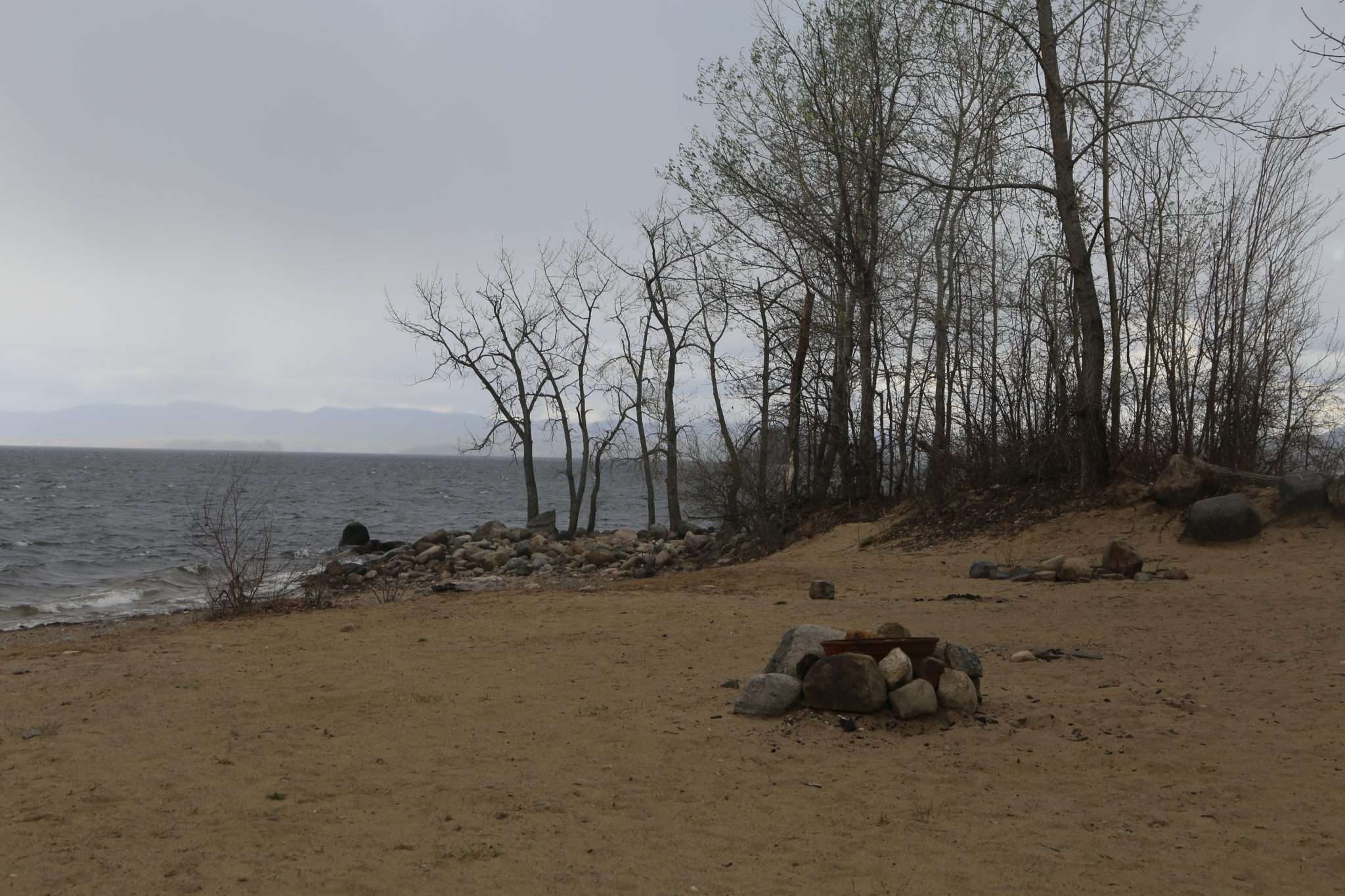 An illegal fire pit on the Broadalbin Beach looking out on Great Sacanadaga Lake.