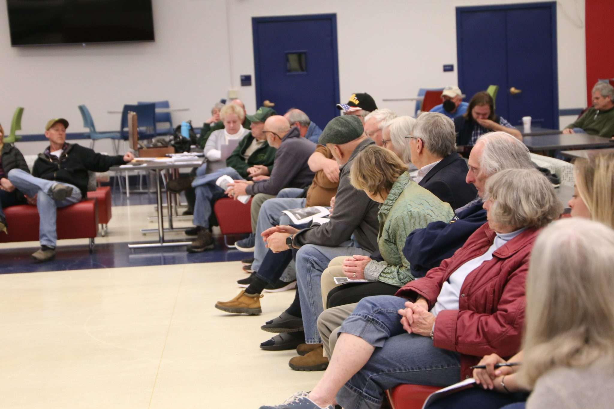 About three dozen people listen to staff from the state Department of Environmental Conservation inside the cafeteria of the Broadalbin-Perth High School.