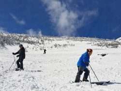 Two men skiing on a mountain