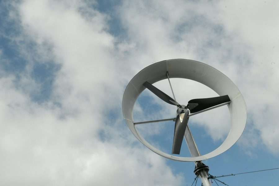 A ducted wind turbine in a cloudy sky.