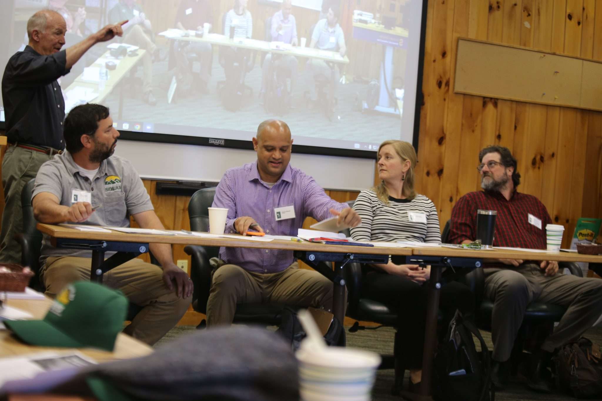 Panelists speak about the transition to renewable energy on Saturday before the Adirondack Landowners Association at a meeting in Blue Mountain Lake.