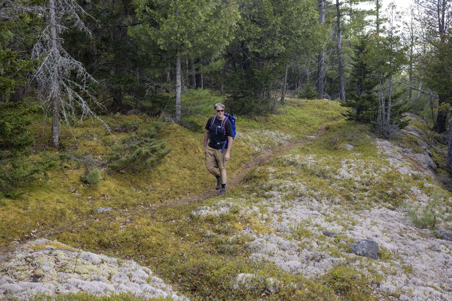 Tim Rowland hikes Jones Hill near Schroon Lake. Photo by Mike Lynch