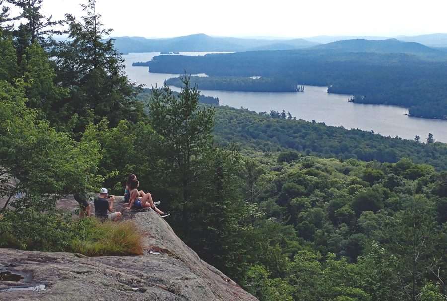 hikers on a ledge of bald/rondaxe mountain