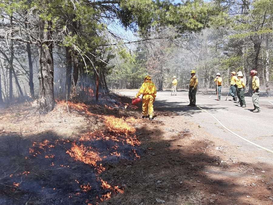 Firefighters perform a controlled burn at the Paul Smith's College. The Adirondacks are at low overall risk of severe wildfires