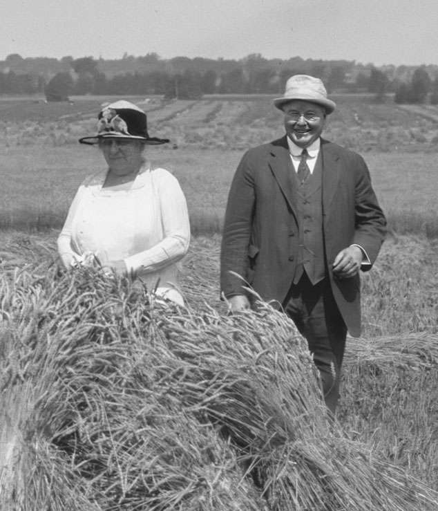 black and white photo of alice and william miner in a wheat field