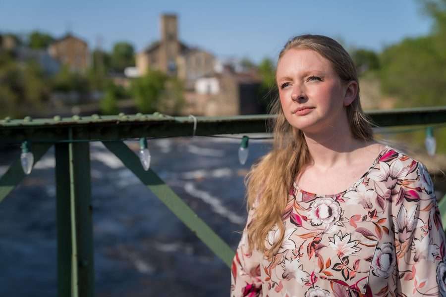 Woman standing on a bridge