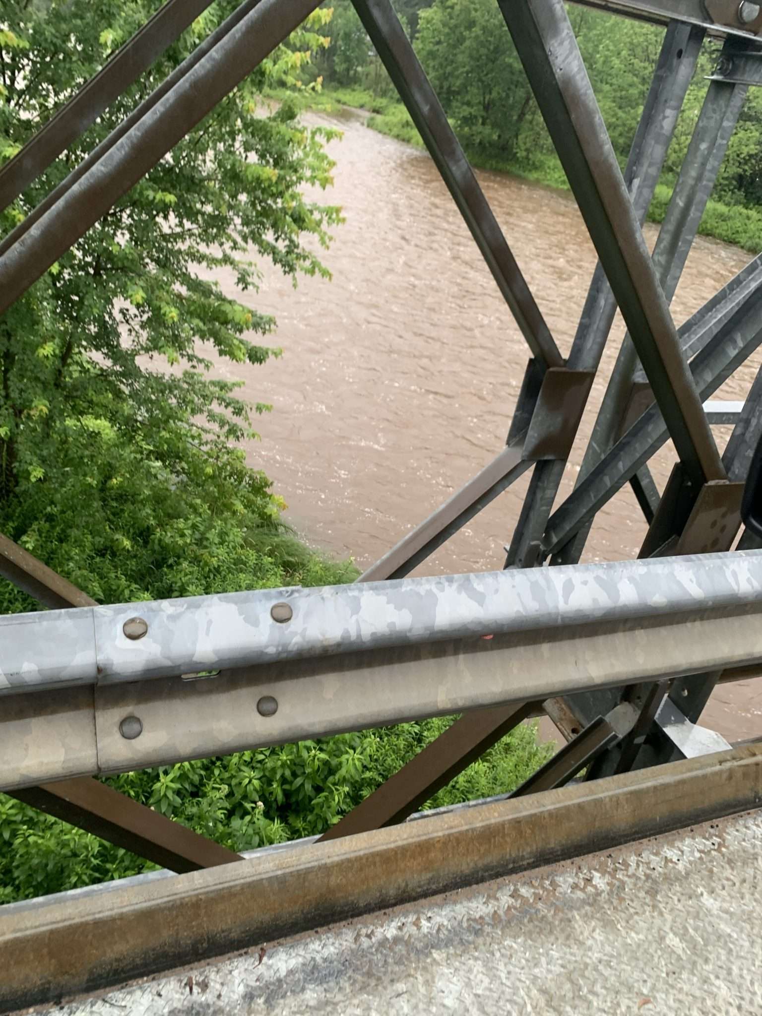 Saranac River in the Adirondacks is high from heavy rainfall, causing flooding concerns.