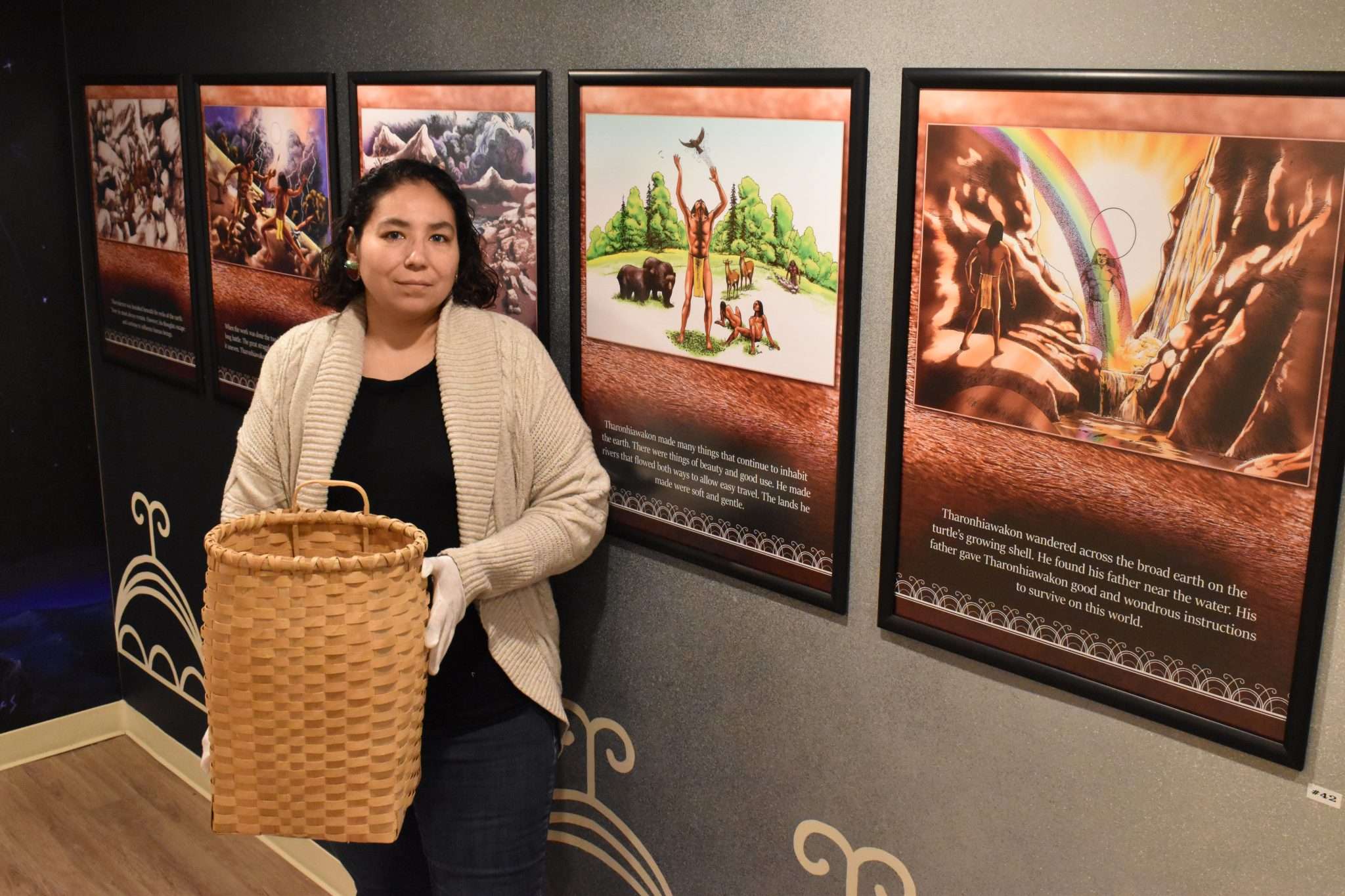 Marla Jacobs, cultural manager of the Akwesasne Cultural Center, holds a historic utility pack. 