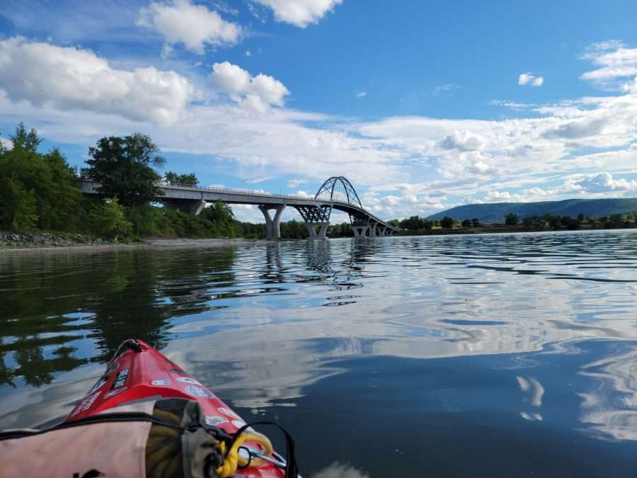 The Champlain Bridge provides a point of reference on the trip up Lake Champlain by kayak.