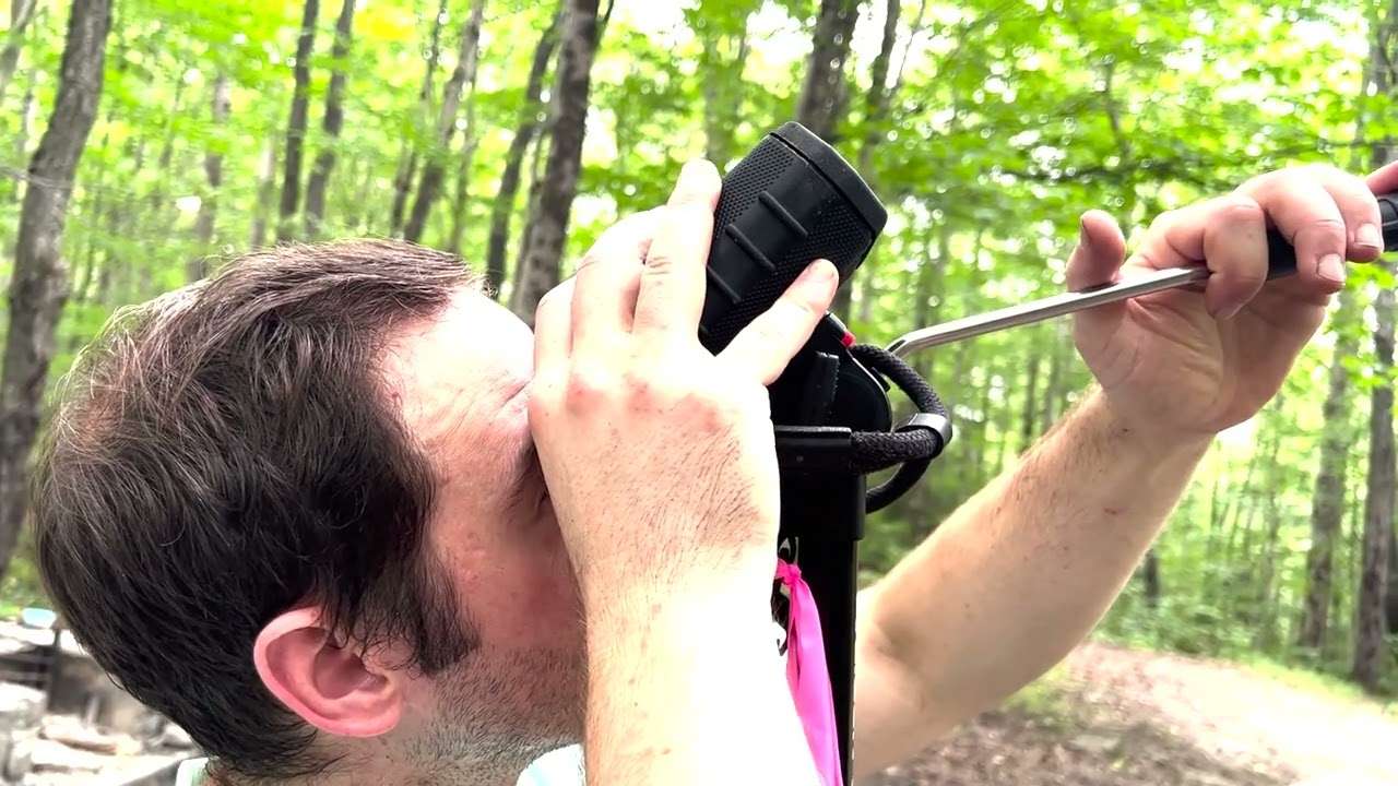 man with instrument used to measure trees