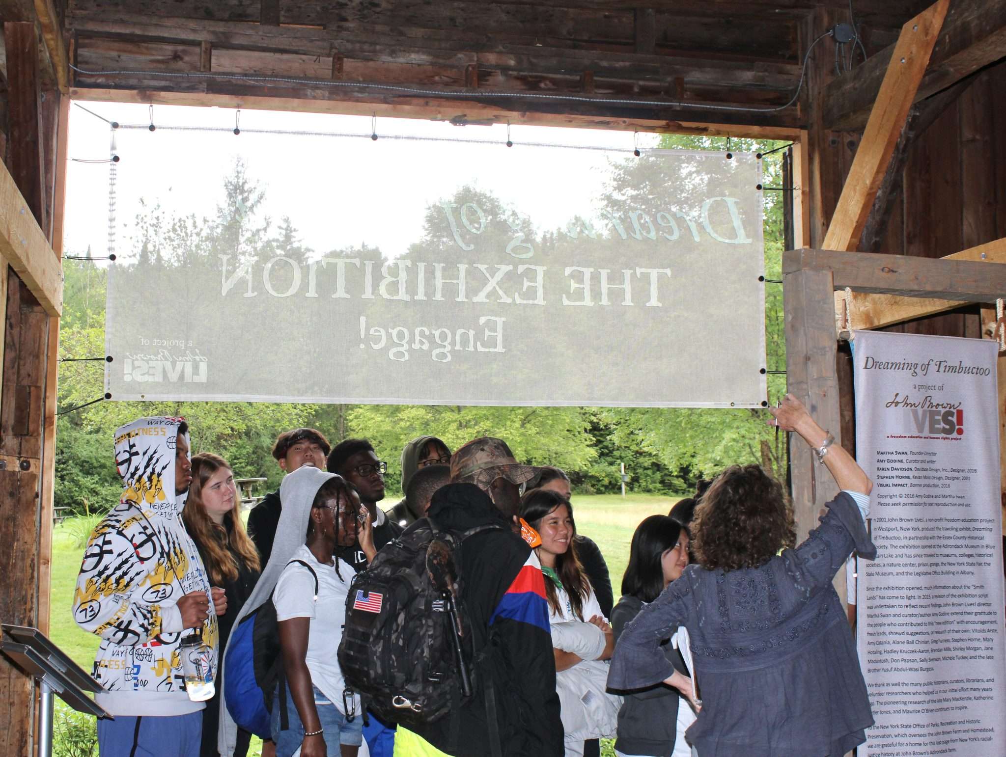 Students gather to learn in a barn at the John Brown Farm Historic Site to learn about Timbuctoo.