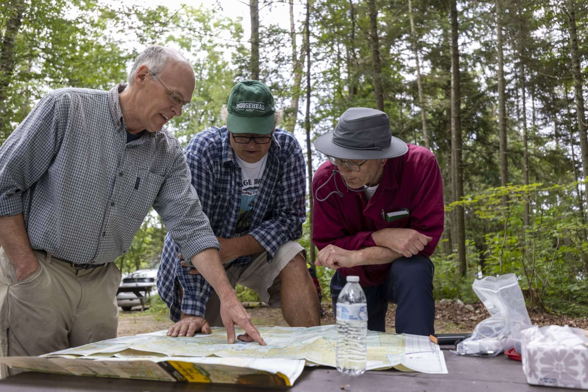 Scientist Bill Brown gives some advice Saturday to Bill Barkley and Jamieson Findlay before the start of their adventure. Photo by Mike Lynch