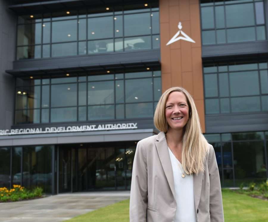 blond woman in front of ORDA building