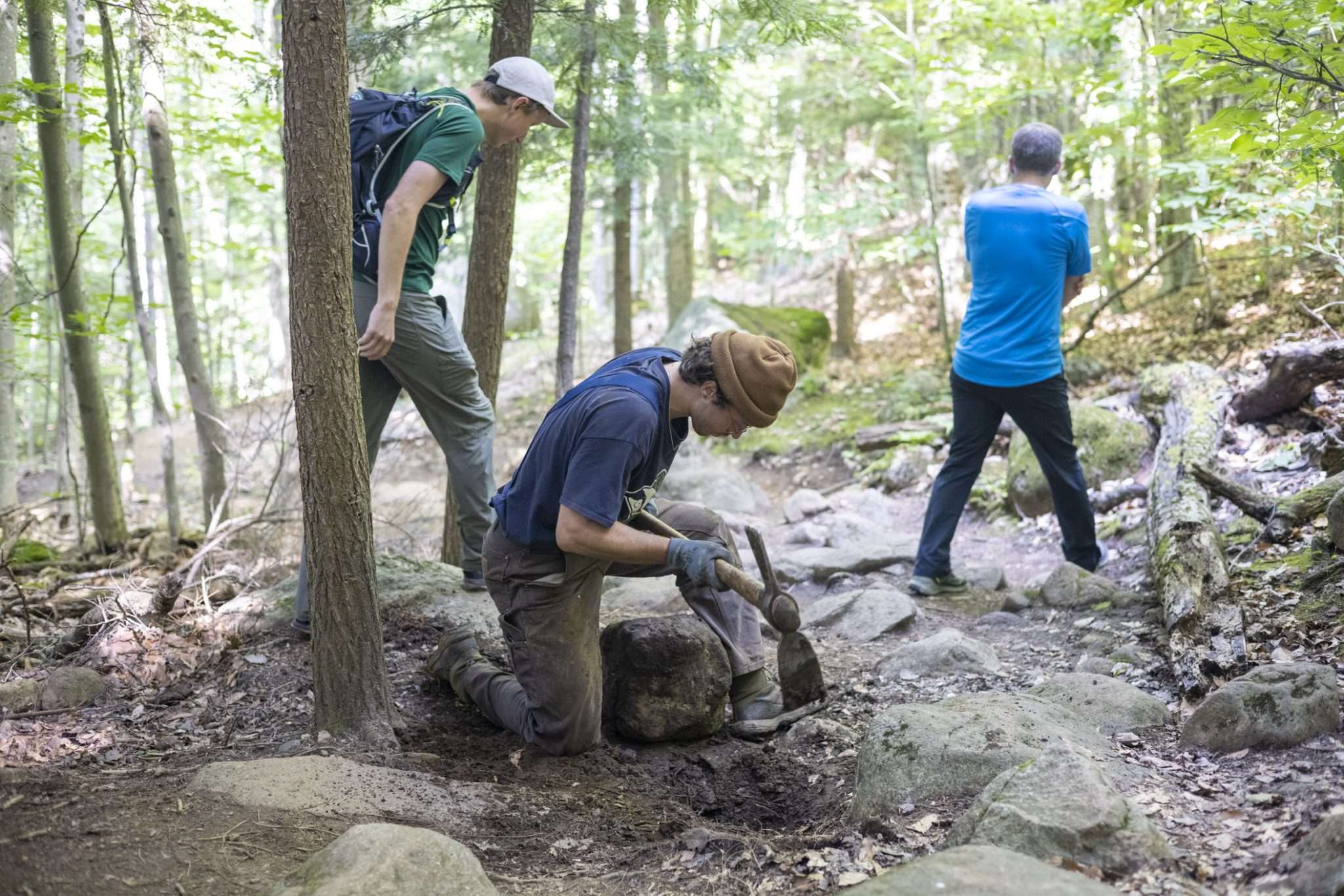 A member of the Adirondack Mountain Club's professional trail crew works on Baker Mountain in early August. Photo by Mike Lynch