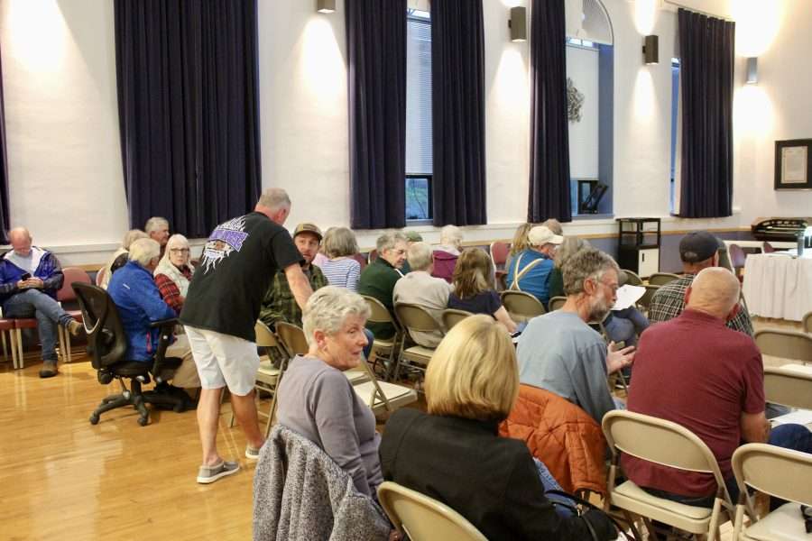 A group of people gathered in a town hall