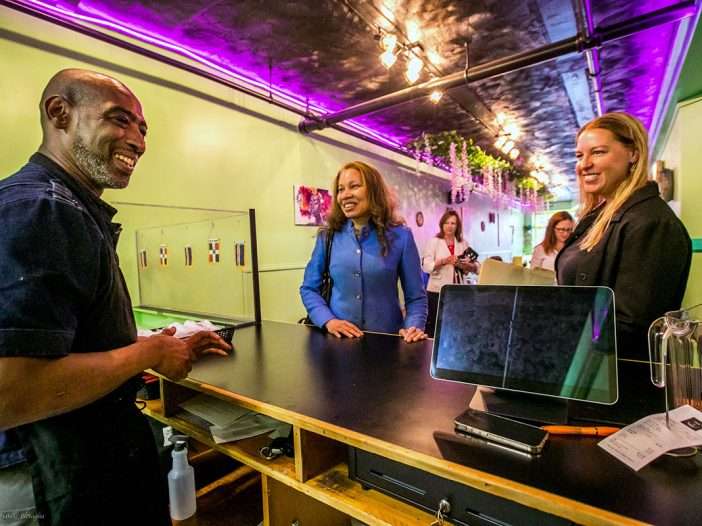 Charles Williams, owner of Our Plates, a new restaurant in Saranac Lake; Hope Knight, Empire State Development President, CEO and Commissioner; and Victoria Duley, executive director of the Adirondack Economic Development Corporation (AEDC).