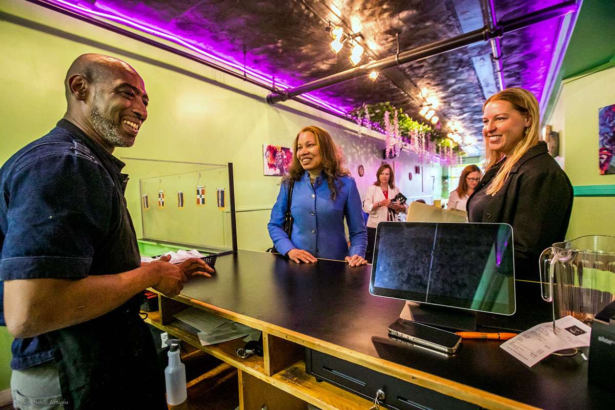 Charles Williams, owner of Our Plates, a new restaurant in Saranac Lake; Hope Knight, Empire State Development President, CEO and Commissioner; and Victoria Duley, executive director of the Adirondack Economic Development Corporation (AEDC).