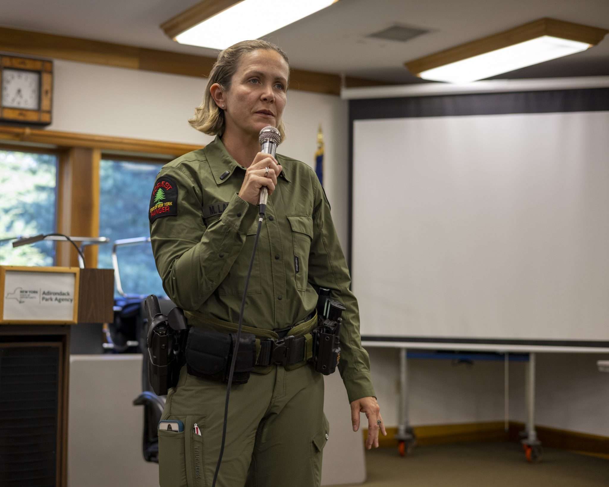 Forest ranger Megan LaPierre speaks at a meeting about the Adirondack Rail Trail in Ray Brook on August 23. Photo by Mike Lynch